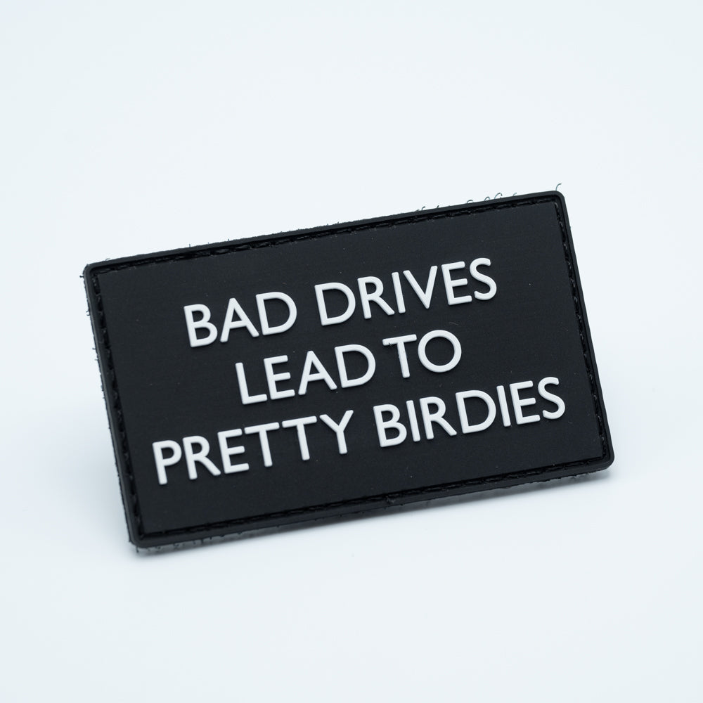 PVC disc golf patch with the text Bad Drives Lead To Pretty Birdies