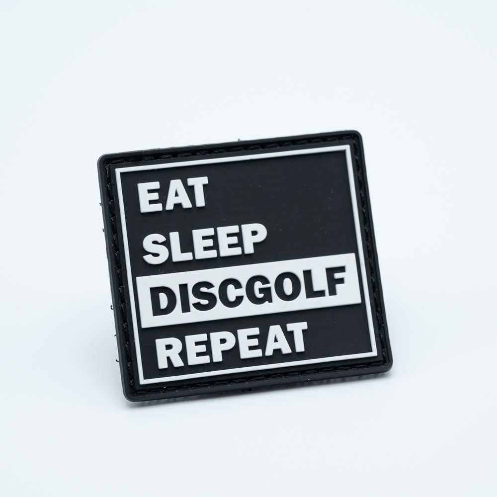 Disc golf pvc patch with the text eat sleep discgolf repeat