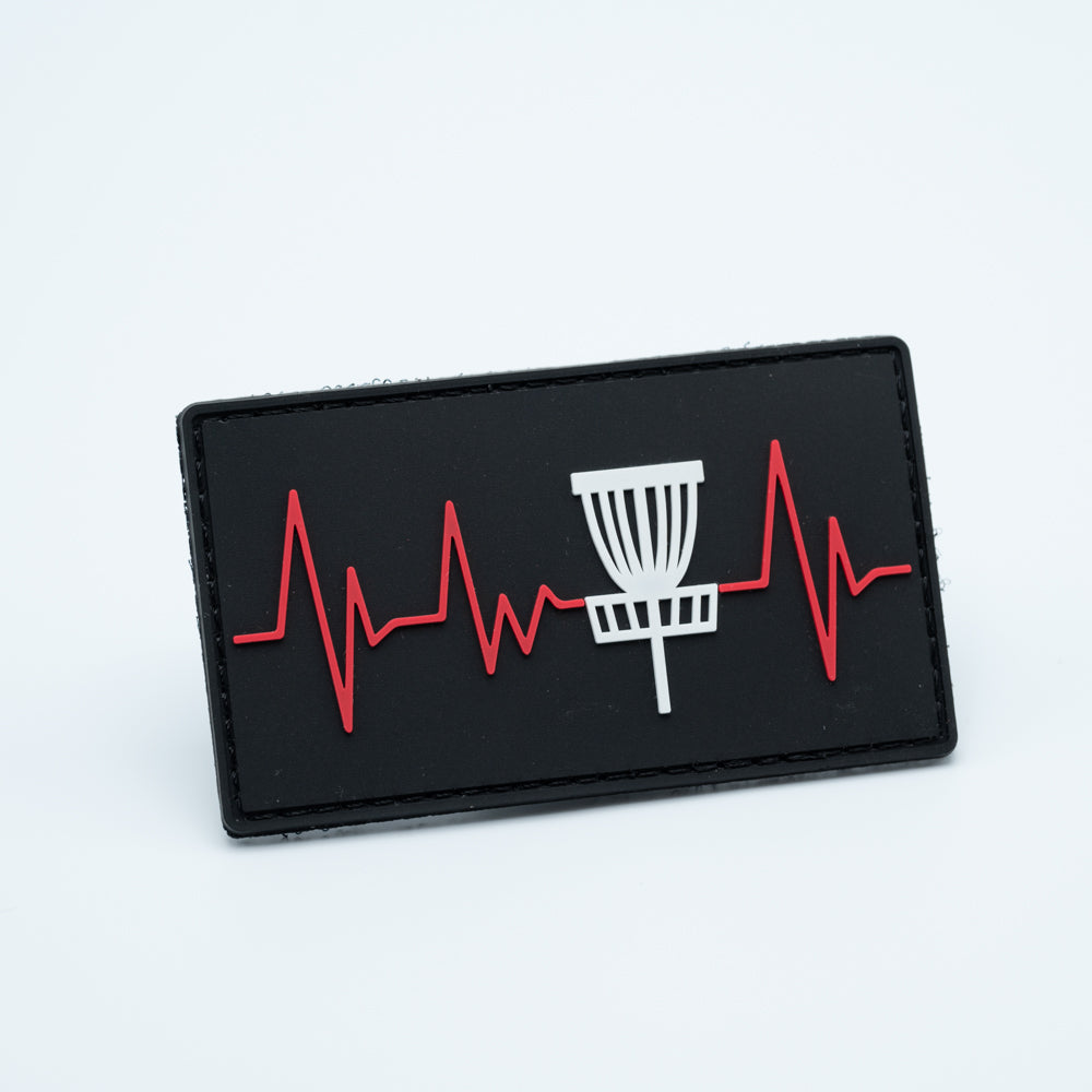 Disc golf patch in pvc with a nice disc golf basket and a heartbeat being shown