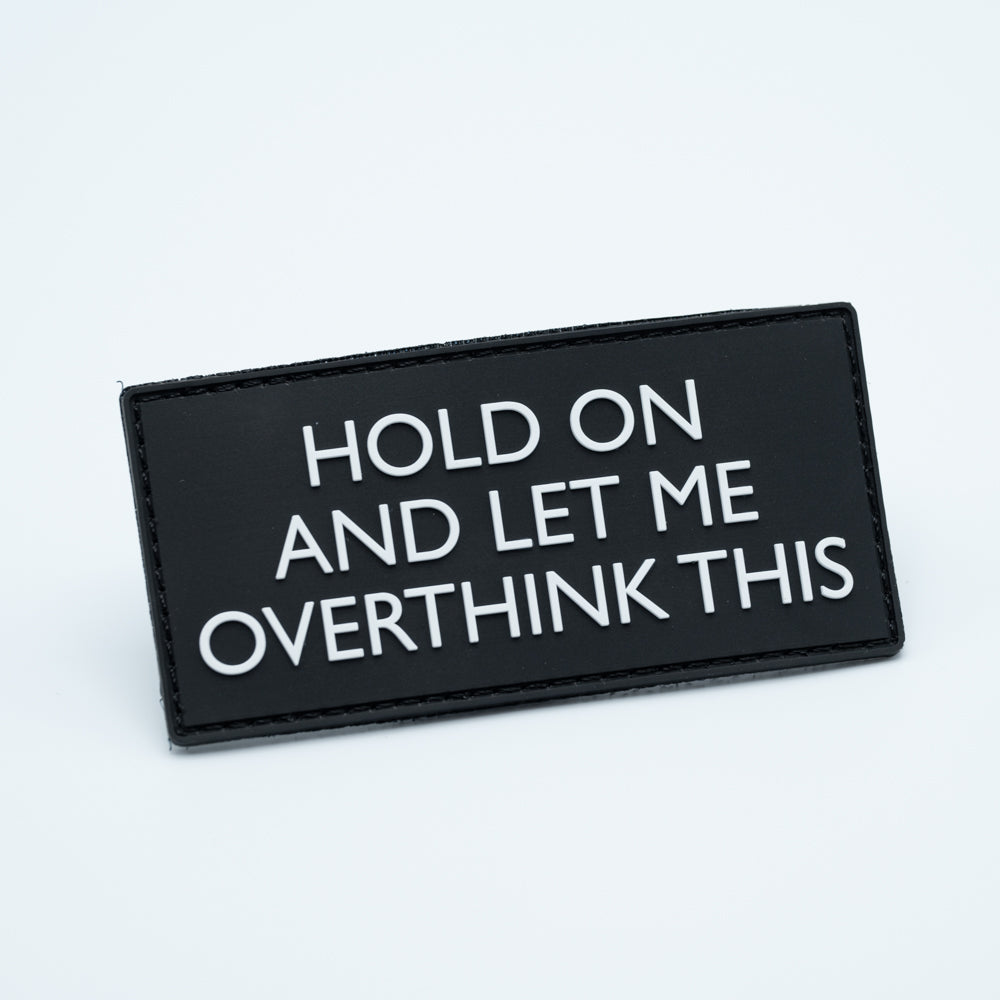 Disc golf patch in pvc with the text Hold on and let me overthink this