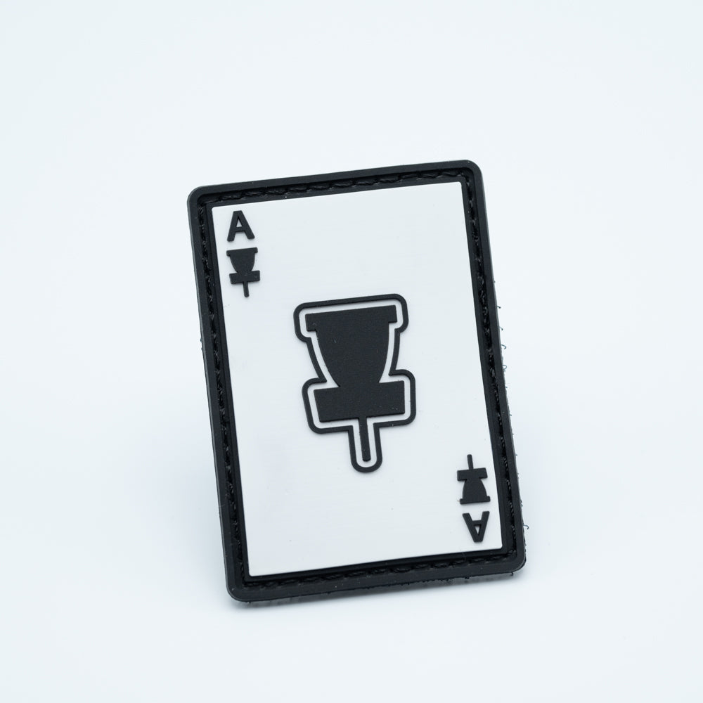 A discgolf pvc patch with a basket and ace on it