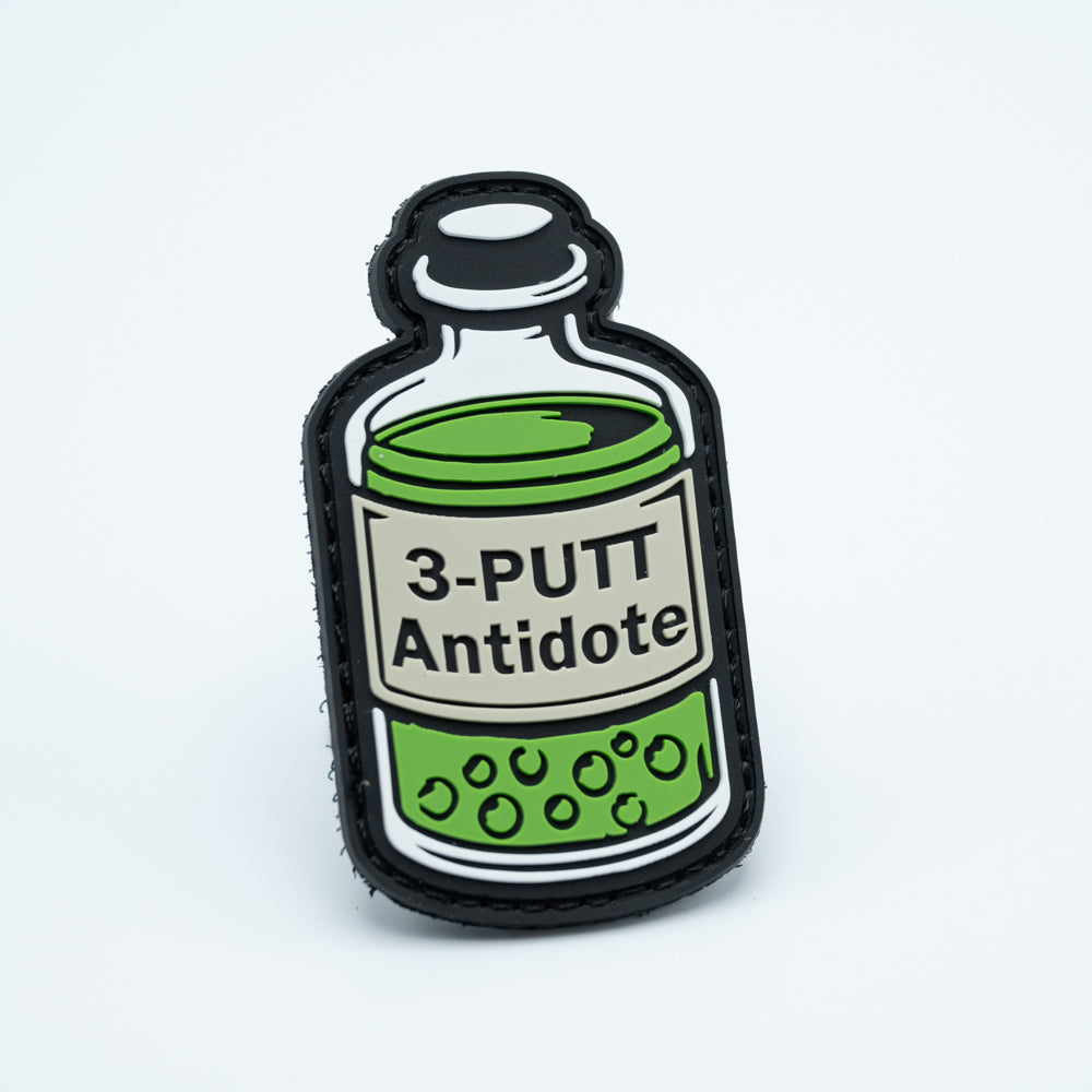 A pvc discgolf patch with the text 3-putt antidote