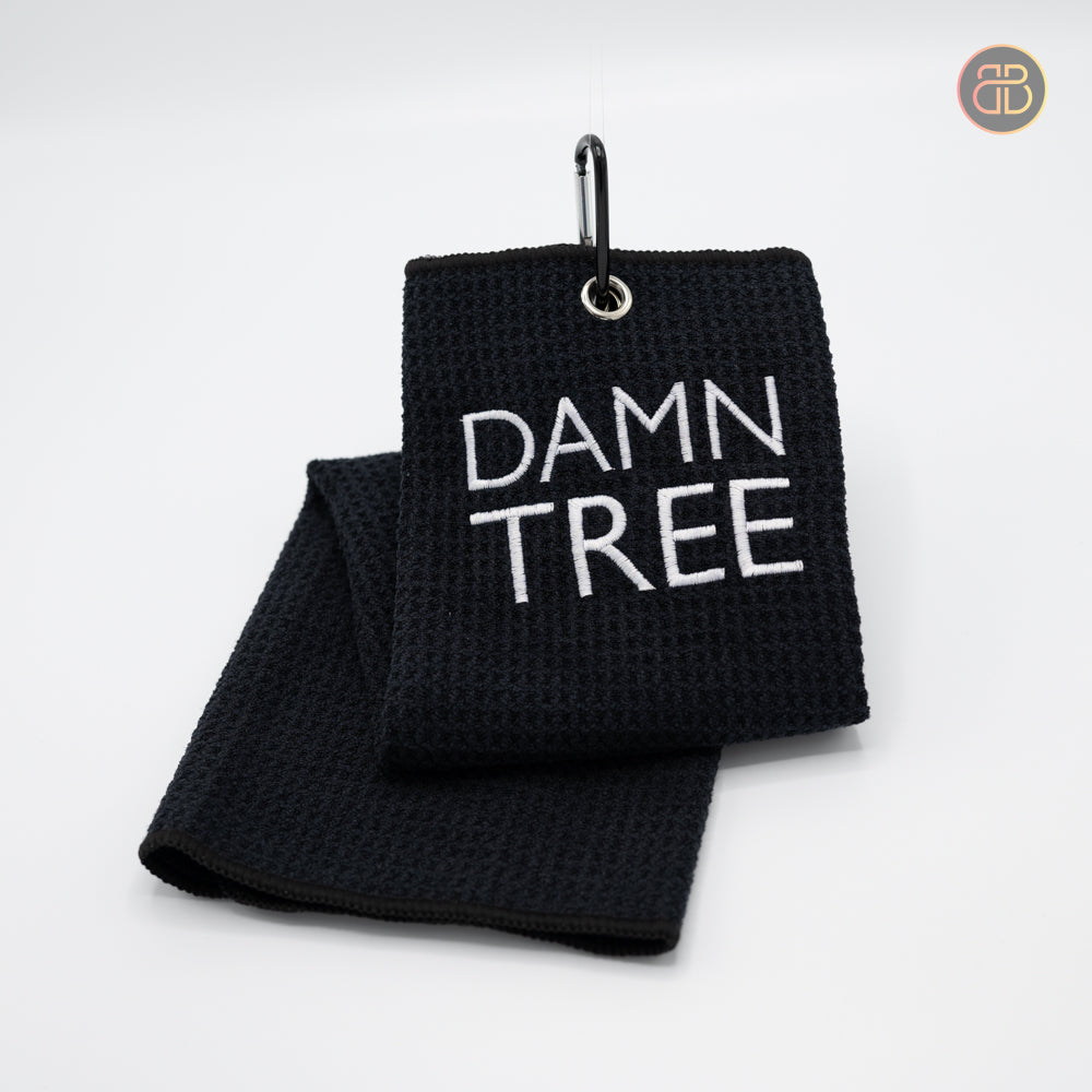 Discgolf towel with the text DAMN TREE 