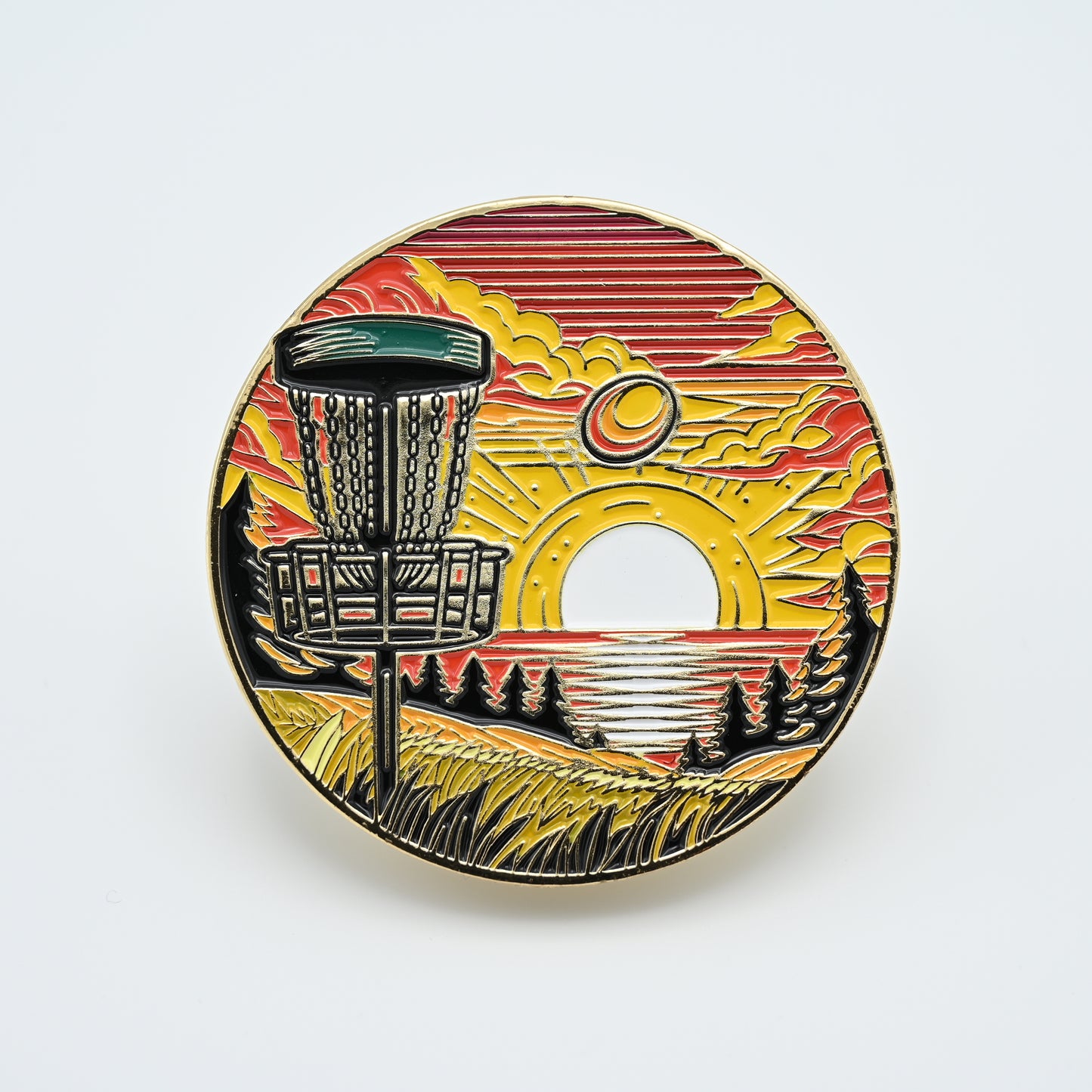 Discgolf pin with a discgolf basket standing close and in the background there is a sunset with a discgolf disc flying towards the discgolf basket.