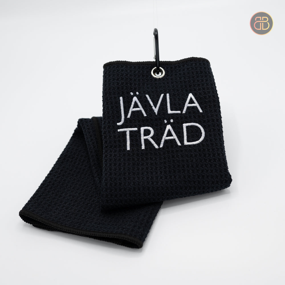 Discgolf towel with the text JÄVLA TRÄD