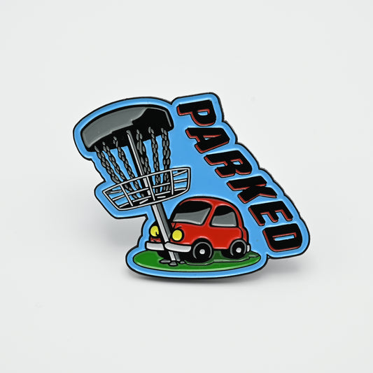 Discgolf pin with a car that has crashed into a discgolf basket and the text PARKED