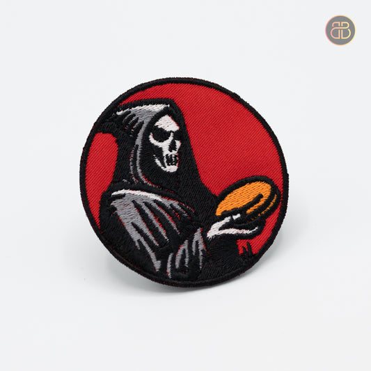 Discgolf patch with a reaper holding a discgolf disc