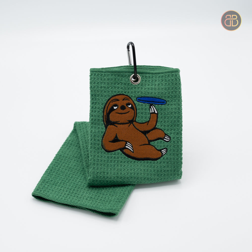 Discgolf towel with a animal holding a discgolf disc and spinning it with his left hand.