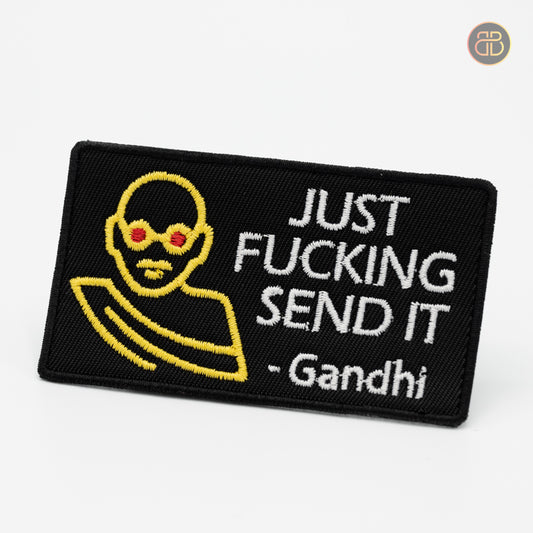 Discgolf patch with the text JUST FUCKING SEND IT and a picture of a monk