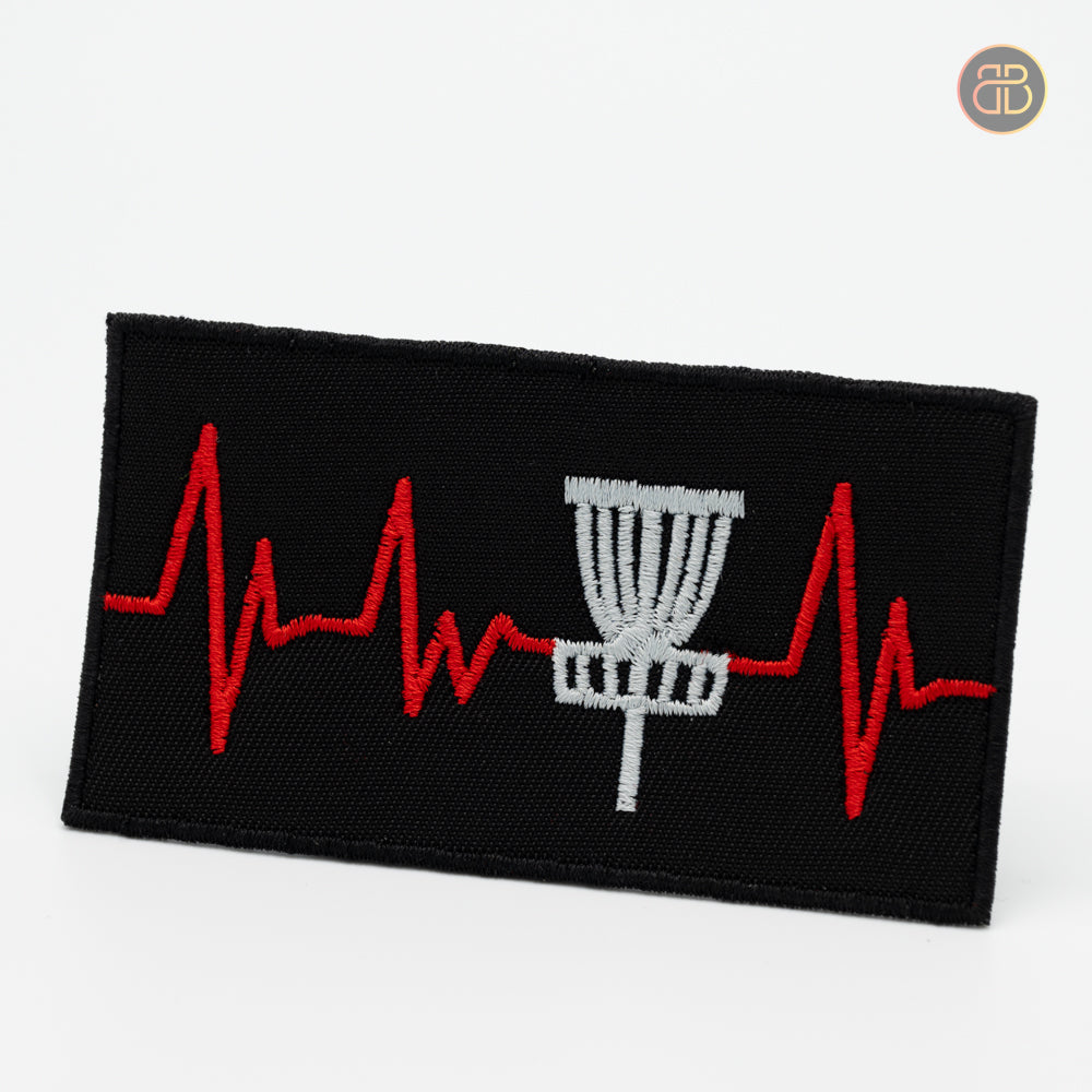 Discgolf patch with a heartbeat going to the discgolf basket showing that its hard to putt sometime