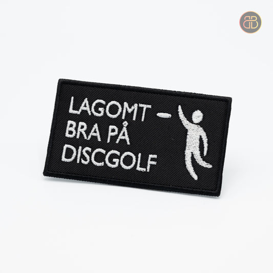 Discgolf patch with the text Lagomt bra på Discgolf